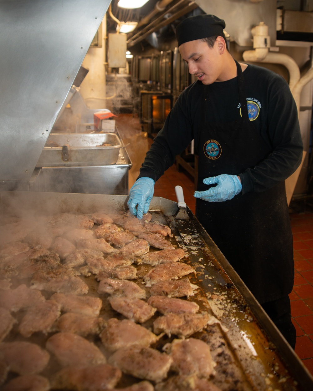 A Nimitz Sailor Grills Chicken