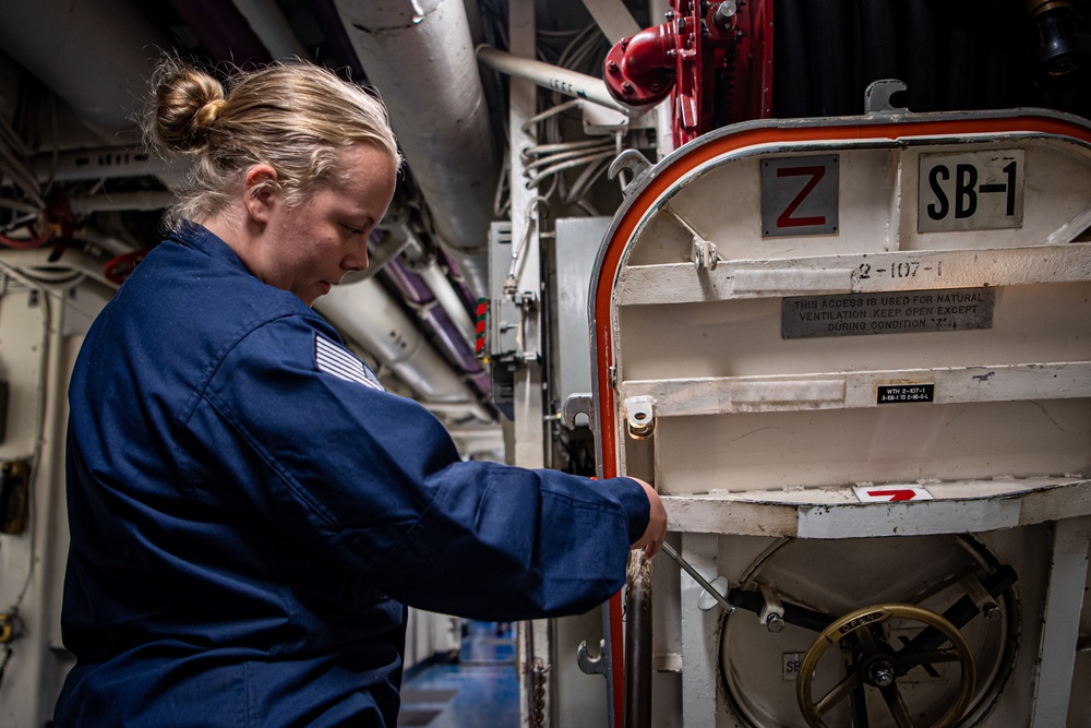 Nimitz Sailors Perform Maintenance On A Scuttle