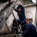 Nimitz Sailors Perform Maintenance On A Scuttle