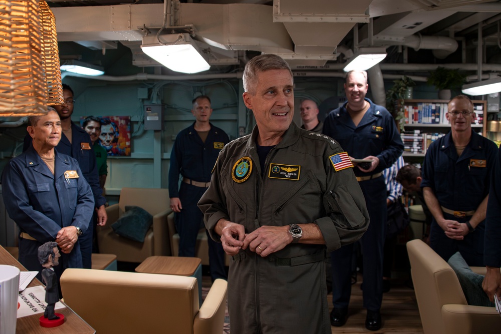 Adm. Steve Koehler tours the USO aboard Abraham Lincoln