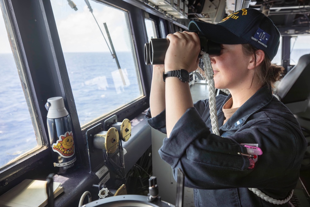 USS Spruance Sailor stands watch