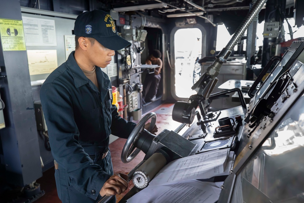 USS Spruance Sailor stands watch