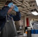 USS Tripoli Sailor Inspects oil