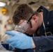USS Tripoli Sailor Inspects oil