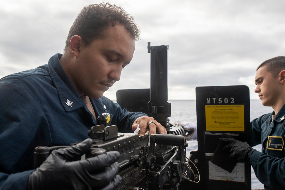 USS Tripoli Sailors Clean M2HB .50-caliber machine gun