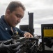 USS Tripoli Sailors Clean M2HB .50-caliber machine gun
