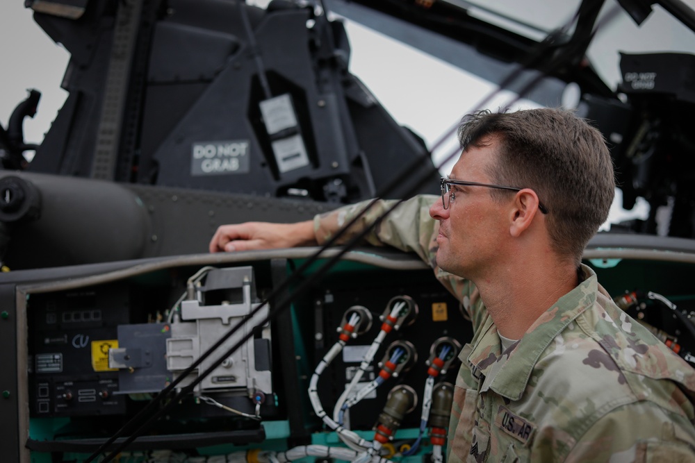 South Carolina Army National Guard helicopter repairers show Apache to youth