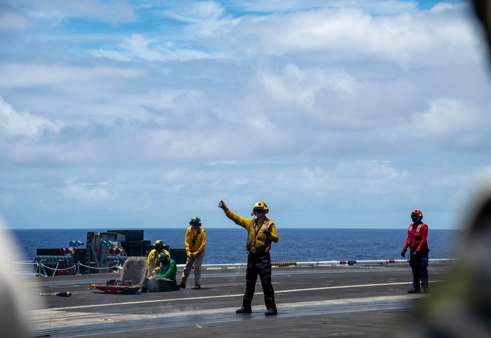 Sailors aboard Nimitz-class aircraft carrier USS Carl Vinson (CVN 70) conduct flight operations.