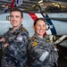 Lt. Cmdr. Eve Parker and Lt. Cmdr. Josh Goener, both assigned to the Royal Australian Navy, pose for a photograph after being promoted in rank in the hangar bay aboard Nimitz-class aircraft carrier USS Carl Vinson (CVN 70).