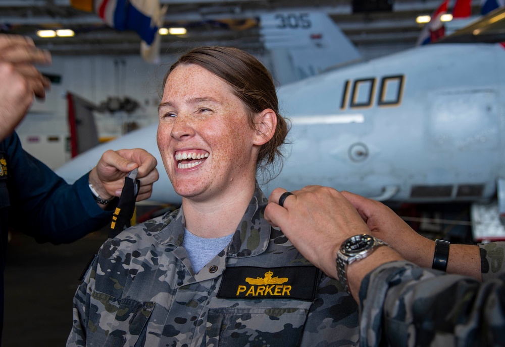Royal Australian Navy Lt. Cmdr. Eve Parker promotes to the rank of commander aboard Nimitz-class aircraft carrier USS Carl Vinson (CVN 70).