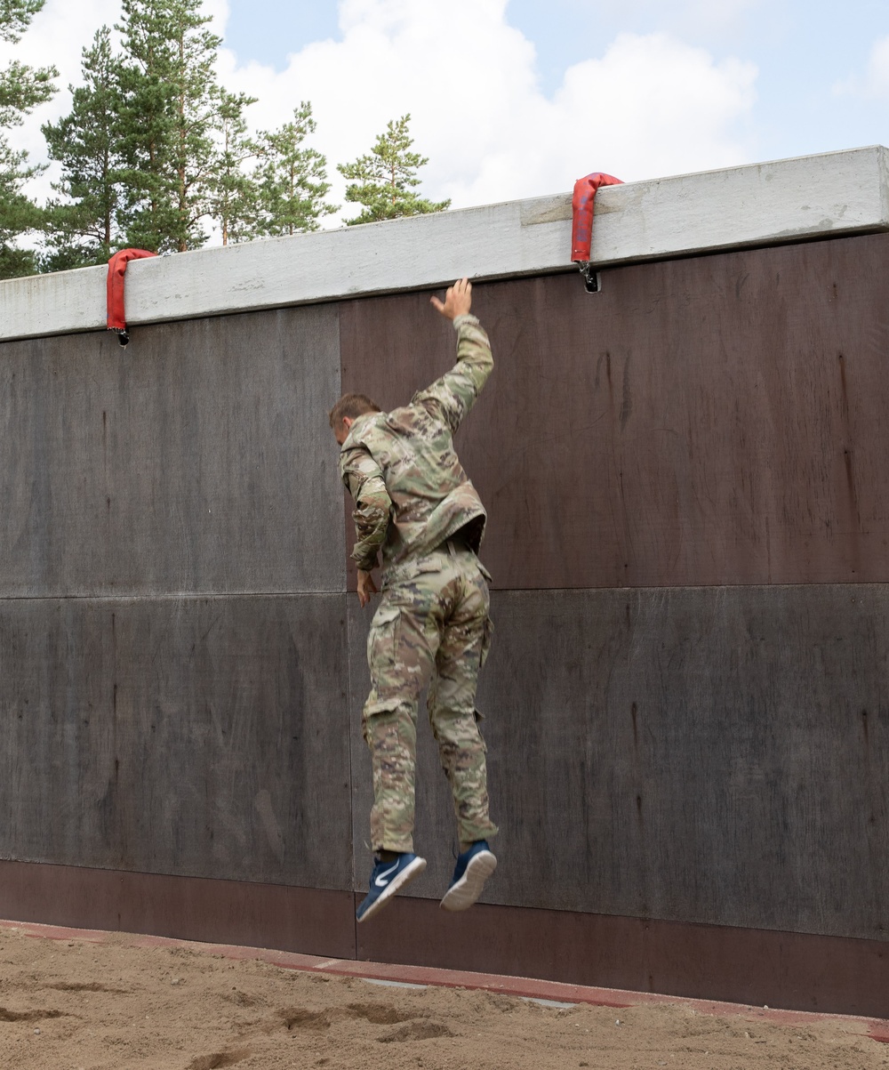 Sgt. Thomas Doles maneuvers off an obstacle