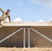 Staff Sgt. Zachary Mills maneuvers over an obstacle