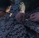 MRF-D 24.3: CLB-5 (Rein.) Sailors apply camouflage netting to a role 2 field hospital