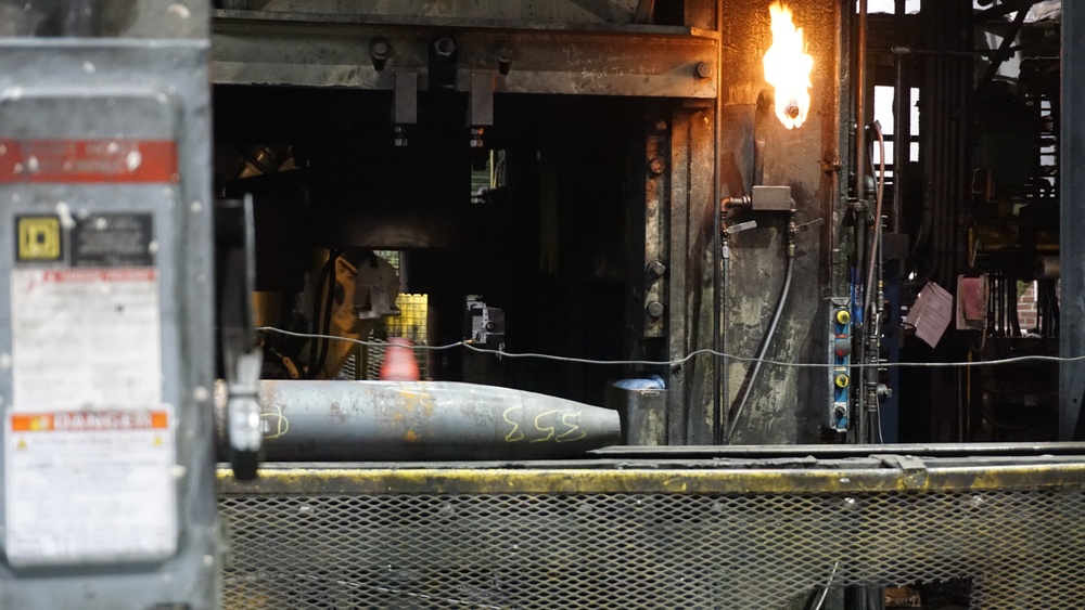 Projectile Cartridge Case Moves Down Conveyor for Inspection