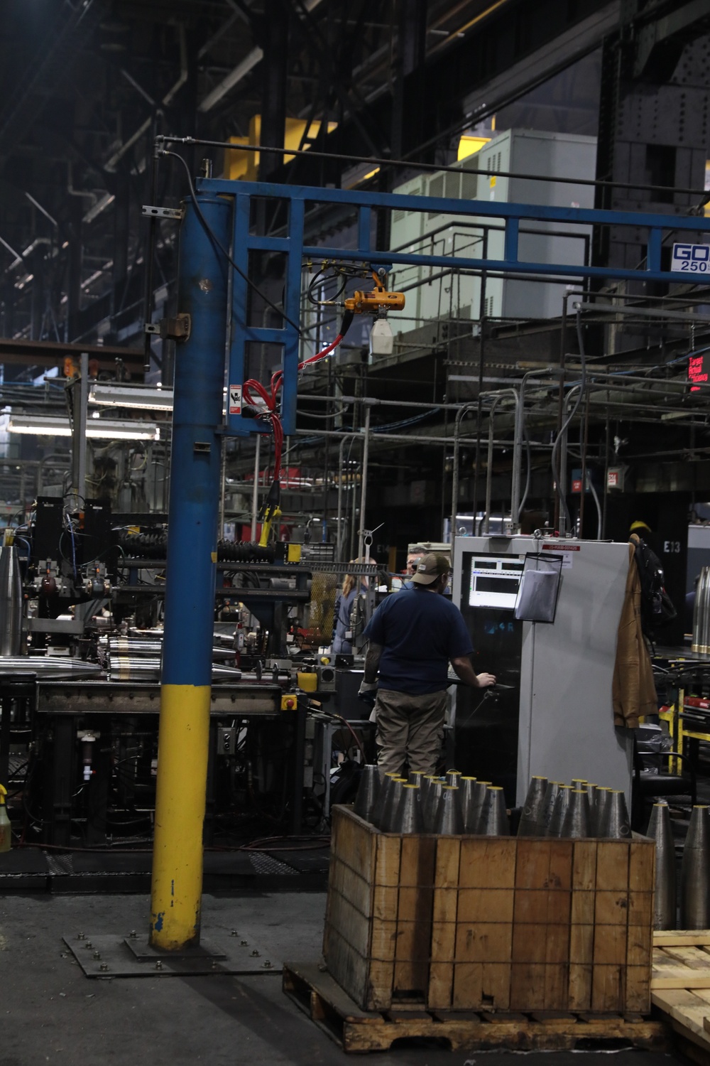 Scranton Army Ammunition Plant Employee checks Projectile Case for Imperfections