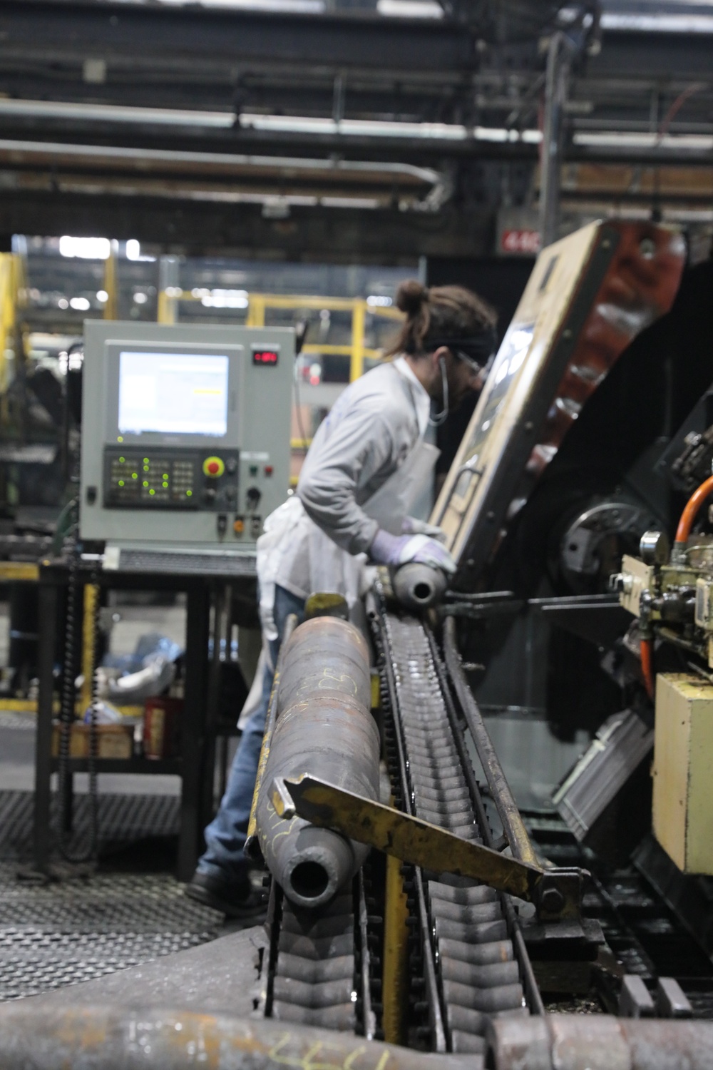 Scranton Army Ammunition Plant Employee Prepares Machinery for the Next Step in the Projectile Case Production Process