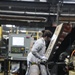 Scranton Army Ammunition Plant Employee Prepares Machinery for the Next Step in the Projectile Case Production Process