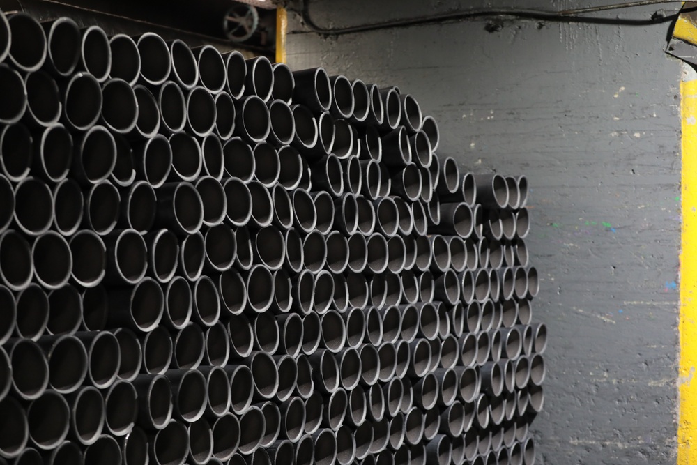 Projectile Cartridge Cases Stacked Awaiting the Next Step in the Production Process