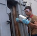 USS Spruance Sailor conducts maintenance