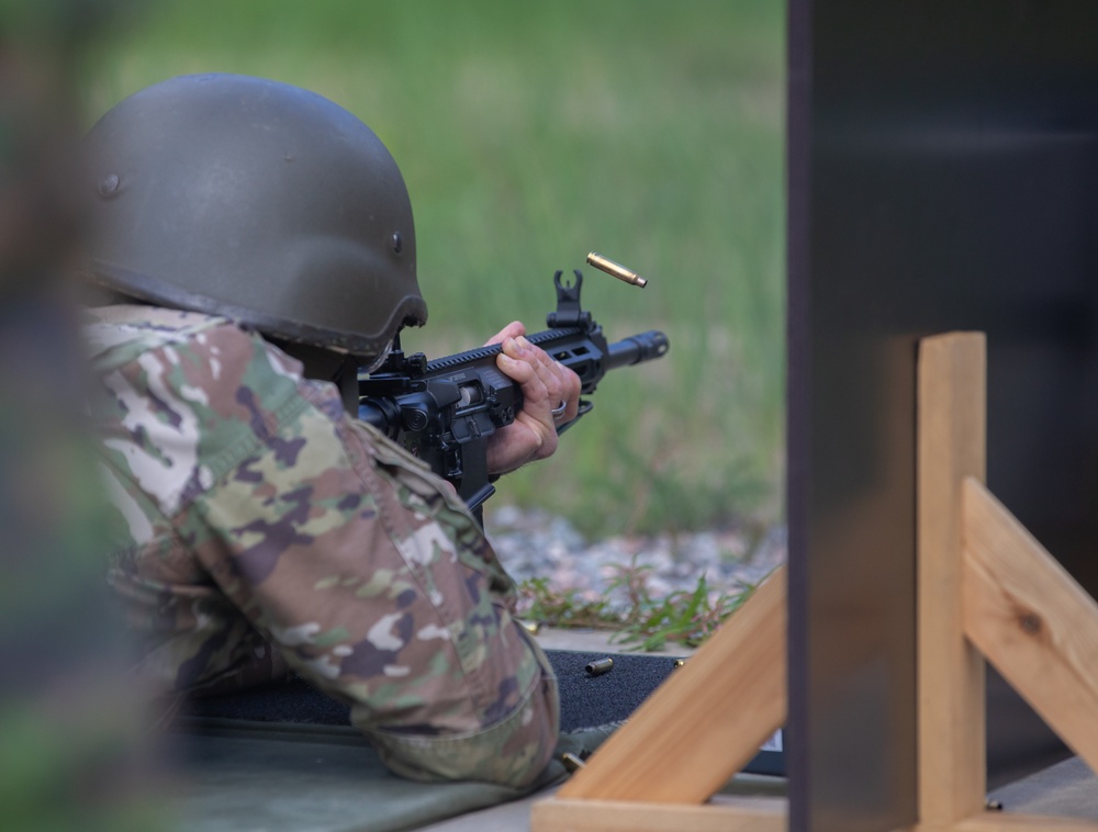 Lt. Col. Thomas Sebastiani shoots a LMT R-20 Rahe rifle