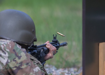 Lt. Col. Thomas Sebastiani shoots a LMT R-20 Rahe rifle