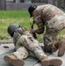 Sgt. 1st Class Kristoffer Friend assists team USA in adjusting their weapons