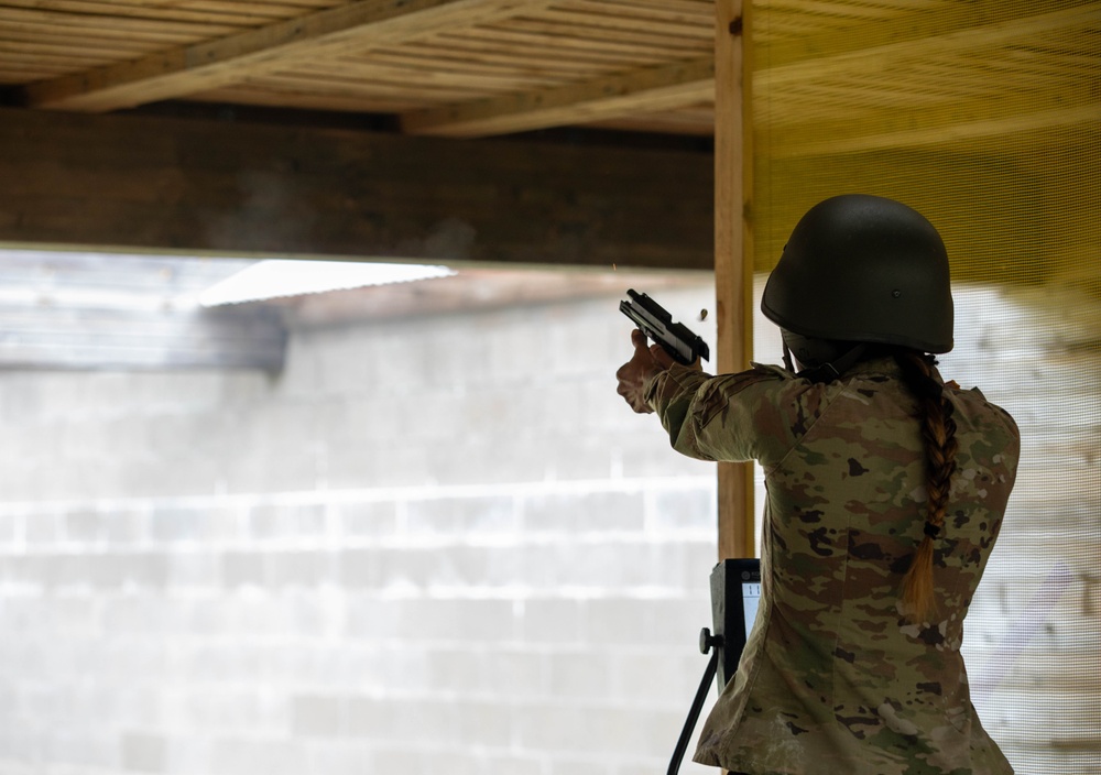 1st Lt. Jessica Romero fires a Heckler &amp; Koch USP