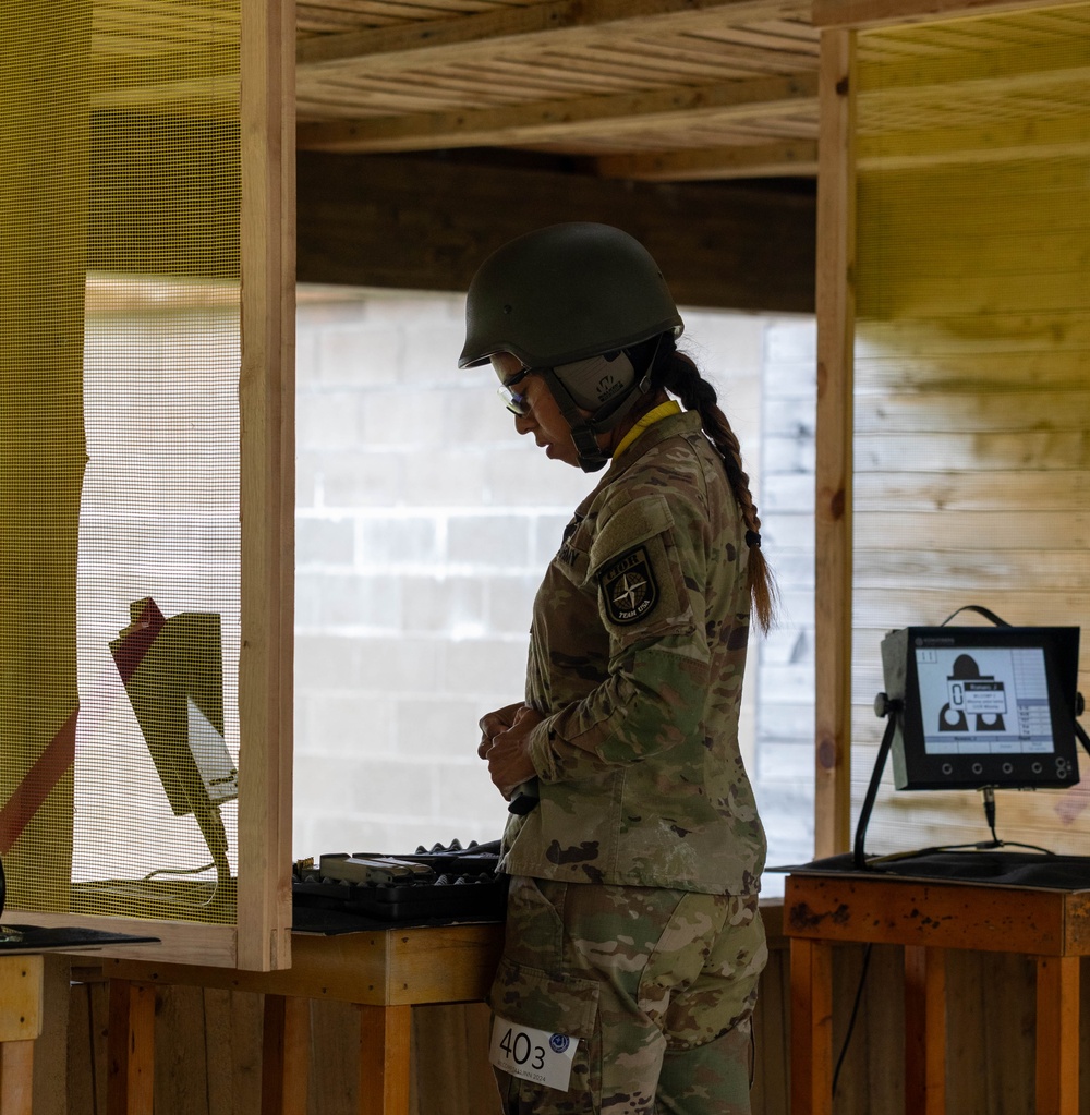 1st Lt. Jessica Romero loads a magazine