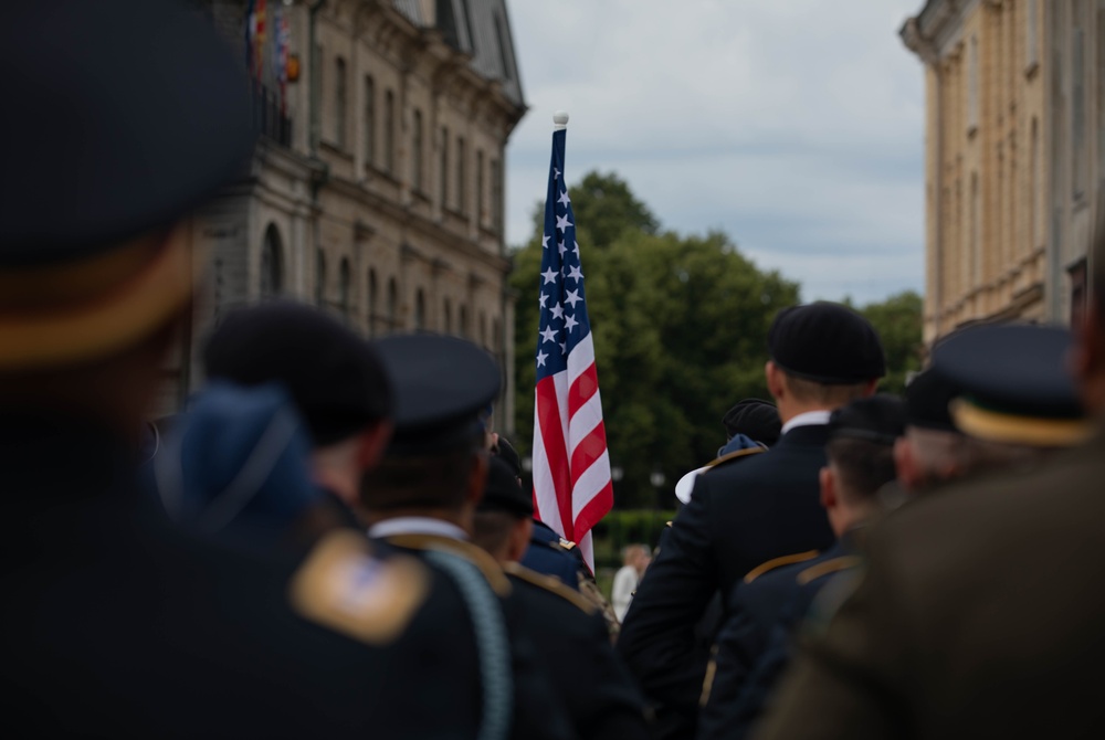 U.S. service members stand at attention