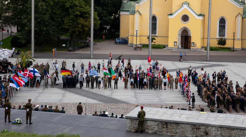NATO countries stand in separate formation