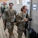 Competitors enter a rifle range