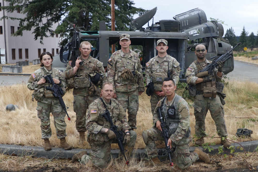 Officer candidates and trainers mark end of field exercises