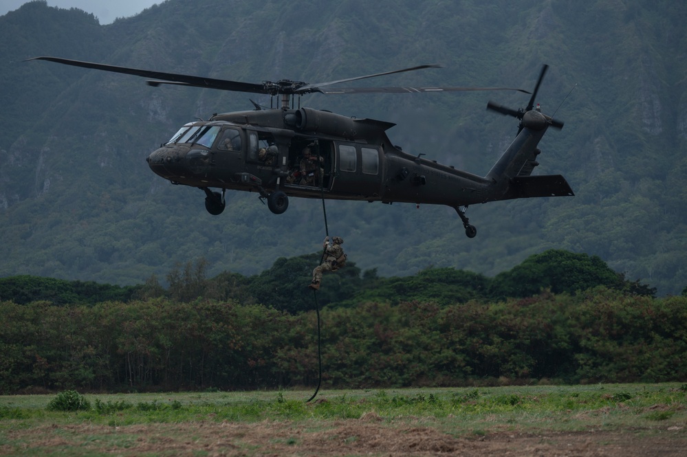 Explosive Ordnance Disposal technician rappels from U.S. Army UH-60 Black Hawk during RIMPAC 2024