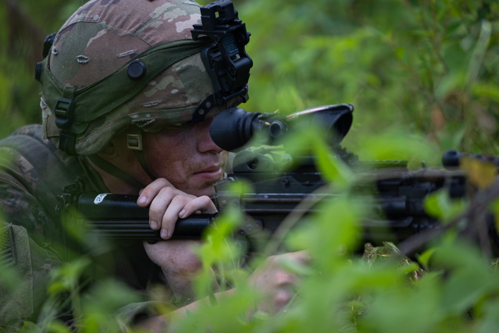 Charlie Co. of the 1-167th Infantry Regiment assaults an enemy position