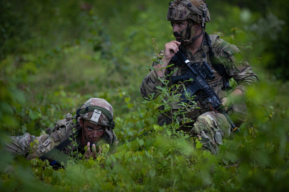 Charlie Co. of the 1-167th Infantry Regiment assaults an enemy position
