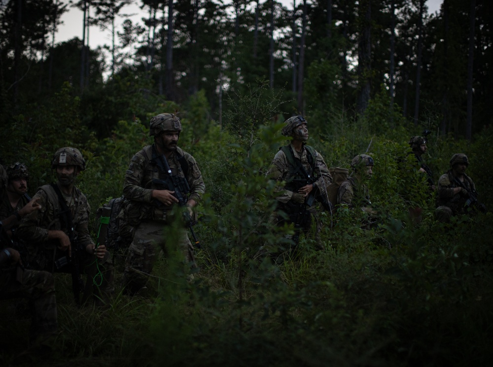 Charlie Co. of the 1-167th Infantry Regiment assaults an enemy position