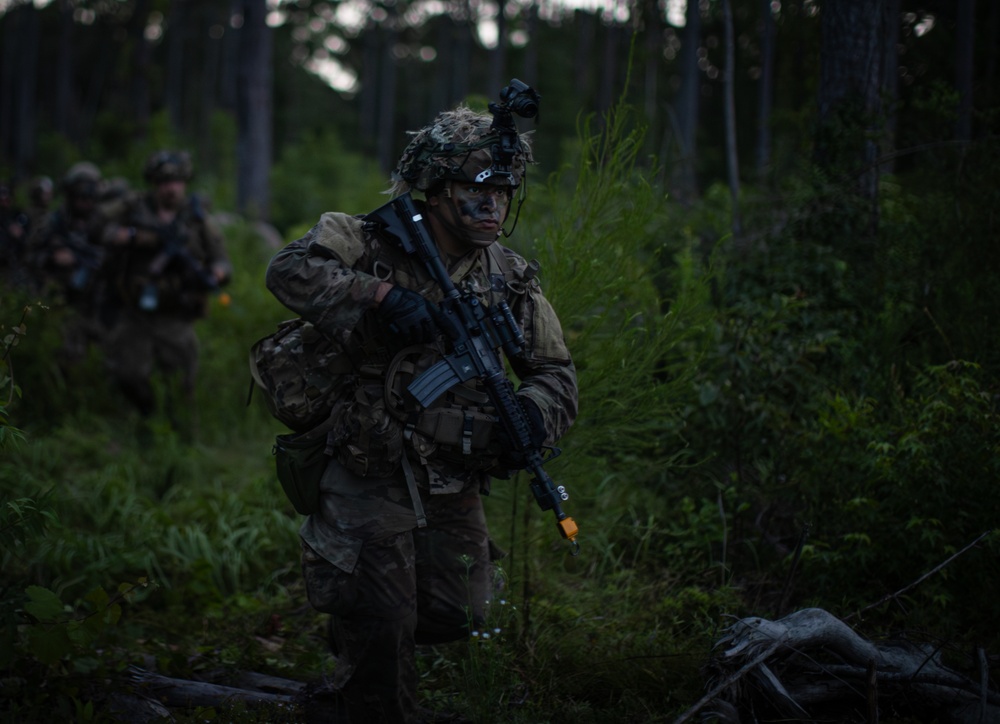 Charlie Co. of the 1-167th Infantry Regiment assaults an enemy position