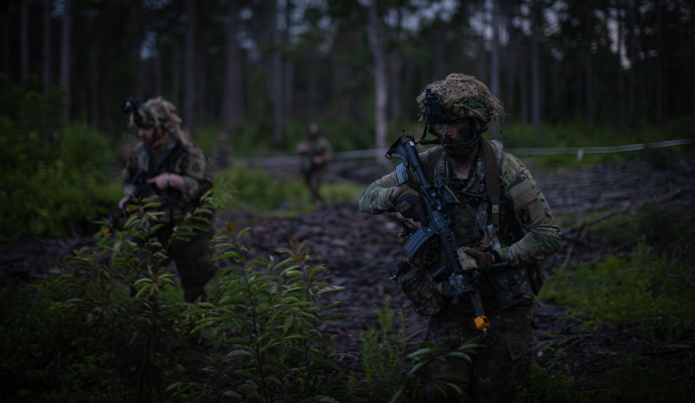 Charlie Co. of the 1-167th Infantry Regiment assaults an enemy position