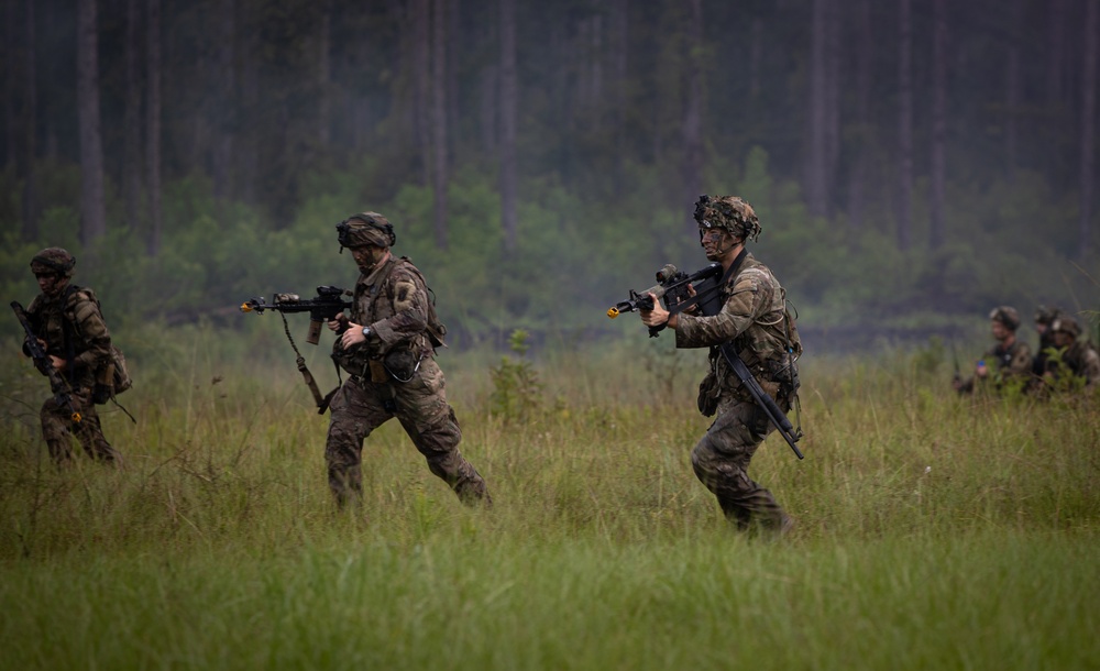 Charlie Co. of the 1-167th Infantry Regiment assaults an enemy position