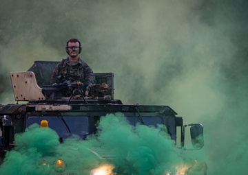 Charlie Co. of the 1-167th Infantry Regiment assaults an enemy position