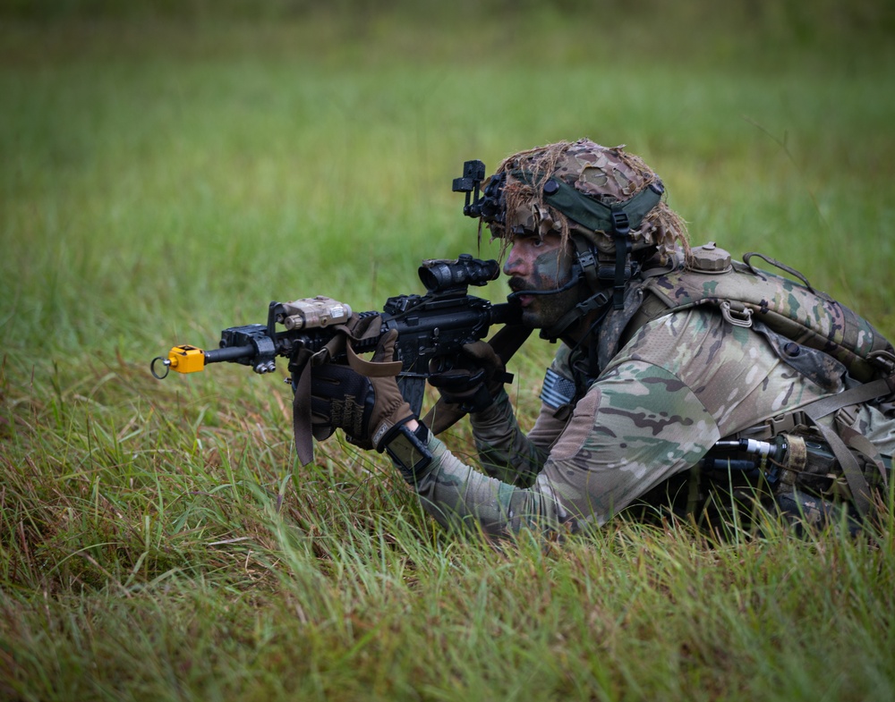 Charlie Co. of the 1-167th Infantry Regiment assaults an enemy position Charlie Co. of the 1-167th Infantry Regiment assaults an enemy position