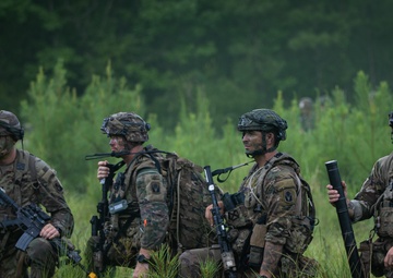 Charlie Co. of the 1-167th Infantry Regiment assaults an enemy position