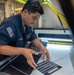 Nimitz Sailor Inspects Plaques