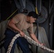 Nimitz Sailor Heaves Line Around A Capstan