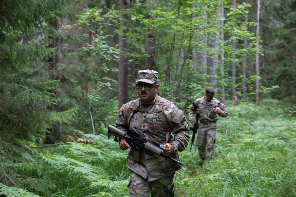 Sgt. 1st Class David Duran runs during an orienteering competition
