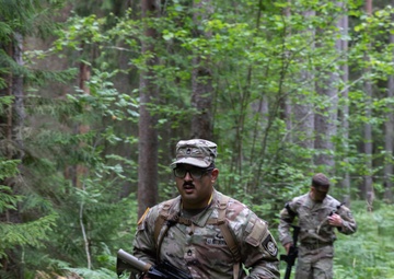 Sgt. 1st Class David Duran runs during an orienteering competition