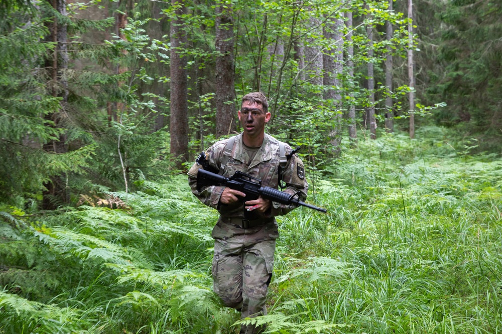 1st Lt. Layton Thorpe runs during an orienteering competition