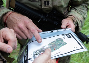 Service members  navigate during a orienteering competition