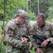 Service members  navigate during a orienteering competition