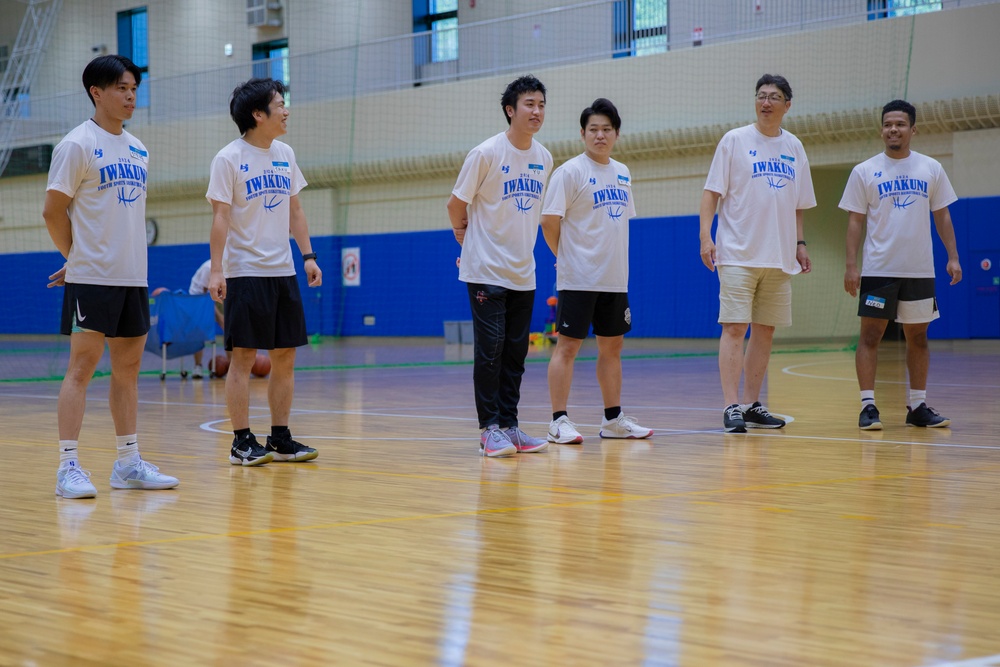 Coaches from Basketball Japan Academy coach children at the Youth Sports Summer Basketball Camp